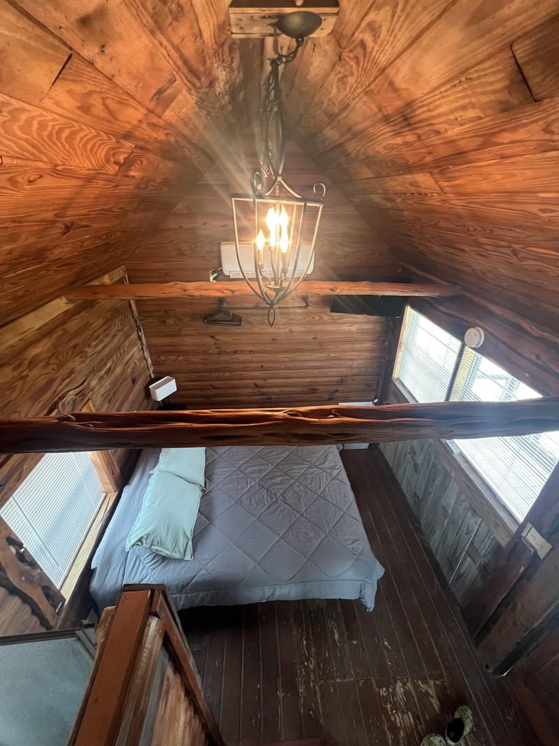 PRIVATE 2-person max Cedar Creek Log Cabin with covered porch 6 miles from I130 (id. 10954)